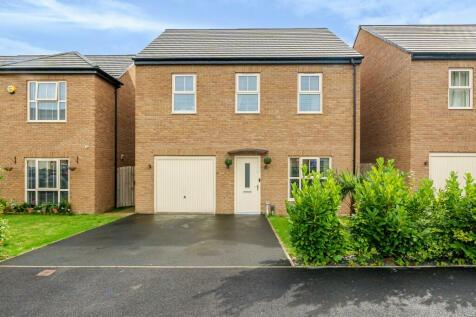 This four bedroom detached property, located on a popular development in Wakefield, is available for £370,000.