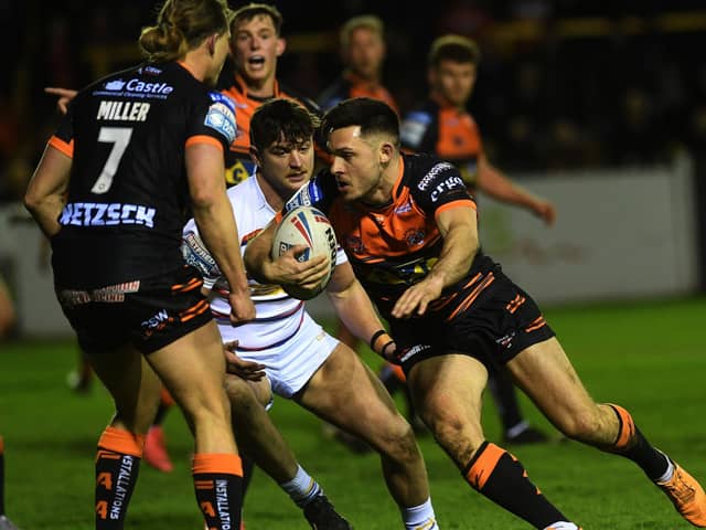 Castleford Tigers full-back Niall Evalds take on the Wakefield Trinity defence. Picture: Jonathan Gawthorpe