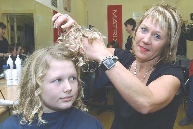 Hairdresser Linda Greatorex and Reece Caunce having his curls cut off for Red Nose Day in 2007.