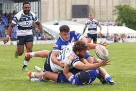 Zach Fishwick appears to be losing control of the ball as he reaches out to try to score for Featherstone Rovers at Barrow. Picture: John Victor