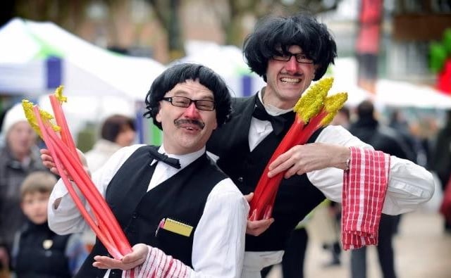 Tony Tyson (right) and Mark Curwood from Diggin Holes Street Theatre, entertain the crowd in 2013.