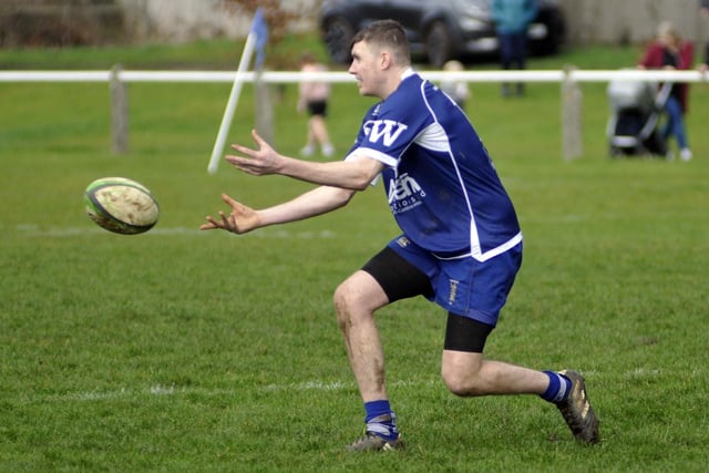 Fly-half Liam Kay passes the ball along the line for another Pontefract attack.