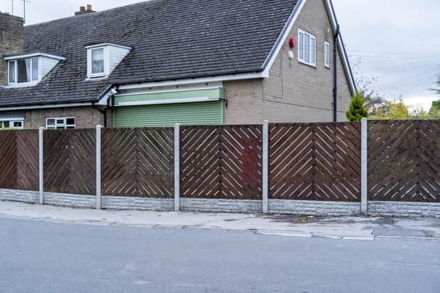 The former Post Office when it was closed and a fence was put up that prevented access to the post box. The post box can be seen to the right of the green shutter. Picture Scott Merrylees