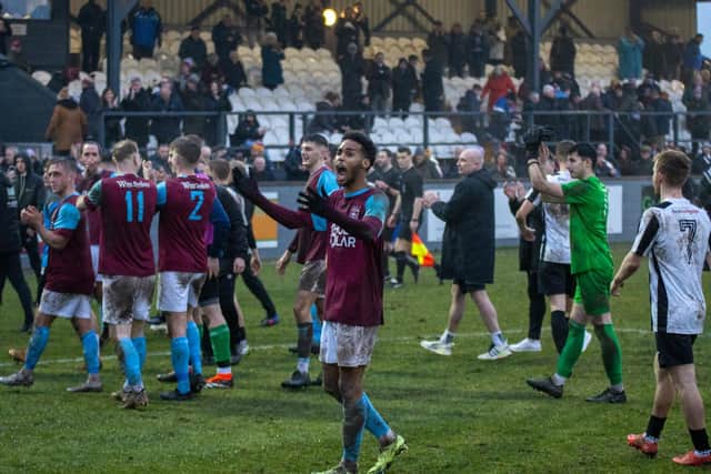 Emley players salute supporters after clinching a quarter-final spot in the FA Vase. Picture: Mark Parsons