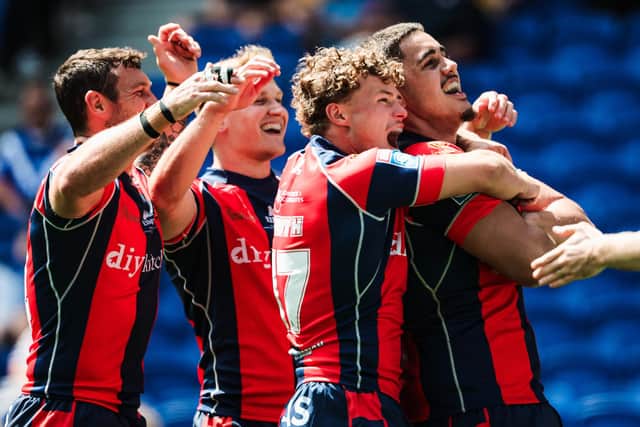 Trin celebrate one of their nine tries against Cas. Picture by Alex Whitehead/SWpix.com