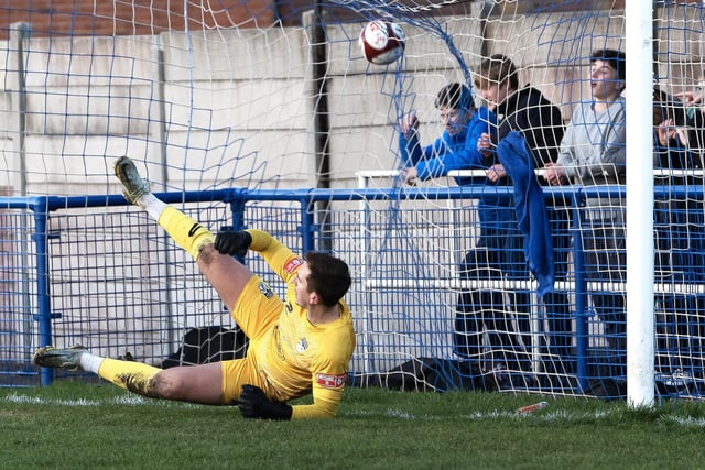 Ossett United goalkeeper Edd Hall is unable to keep out Adam Priestley's first half penalty for Pontefract Collieries.