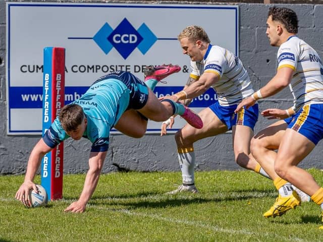 Connor Wynne touches down in the corner for a Featherstone Rovers try at Whitehaven. Picture: JLH Photography