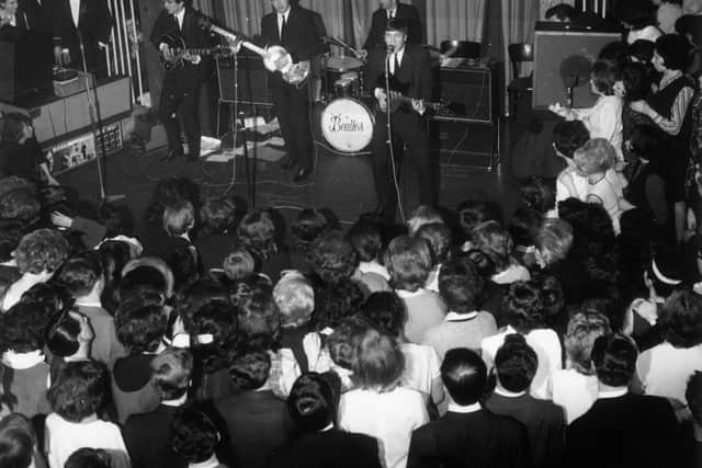 The Beatles playing at the Majestic Theatre, Birkenhead, in 1963.  (Photo by John Pratt/Keystone Features/Getty Images)