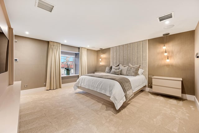 The main bedroom suite includes a dressing room and modern en suite bathroom.
