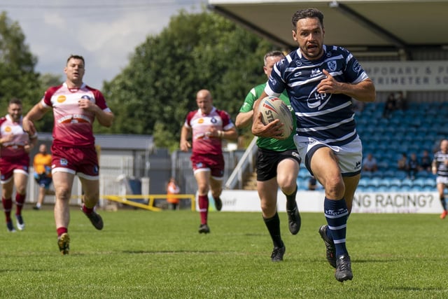 Mark Kheirallah races clear to score a try.