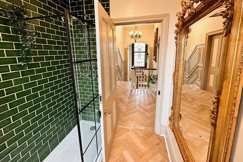Looking from a modern shower room through to the landing.