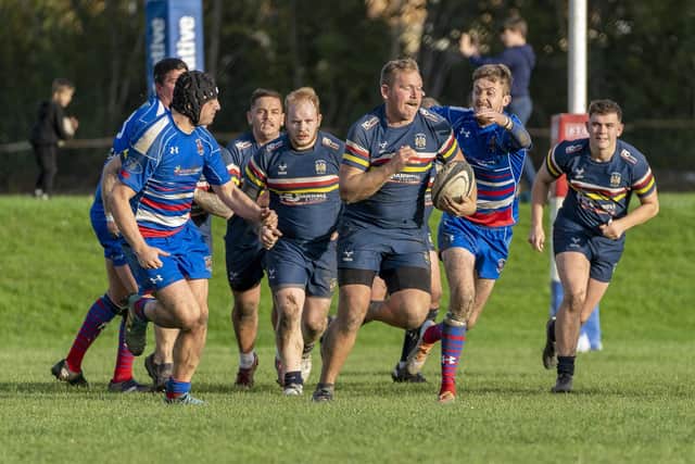 Castleford RUFC were on the charge when they came out on top in their local derby with Knottingley in a close contest.