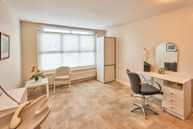 A versatile ground floor room has previously been used as a hair salon.
