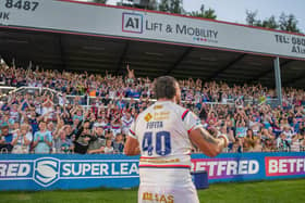 David Fifita celebrates Wakefield Trinity's memorable golden point win over Wigan Warriors with the fans. (Photo: Olly Hassell/SWpix.com)