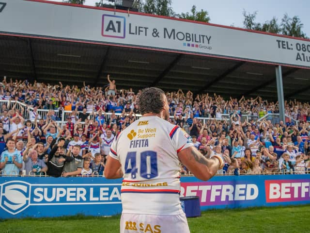 David Fifita celebrates Wakefield Trinity's memorable golden point win over Wigan Warriors with the fans. (Photo: Olly Hassell/SWpix.com)
