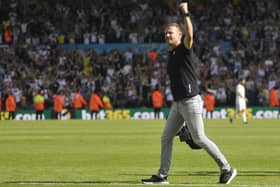 Jesse Marsch salutes the fans after Leeds United's big win against Chelsea.