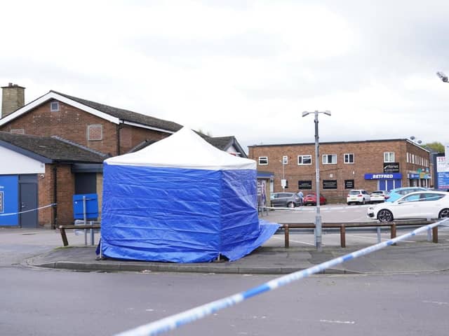 Police taped off part of the car park at Tesco Express on Barnsley Road after the assault