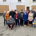 Village residents have objected to a scheme to convert a derelict former business premises into flats and retail units.
