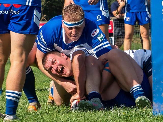 Winners are grinners: Featherstone Lions captain Jordy Walker scores under the posts against Barrow Island.