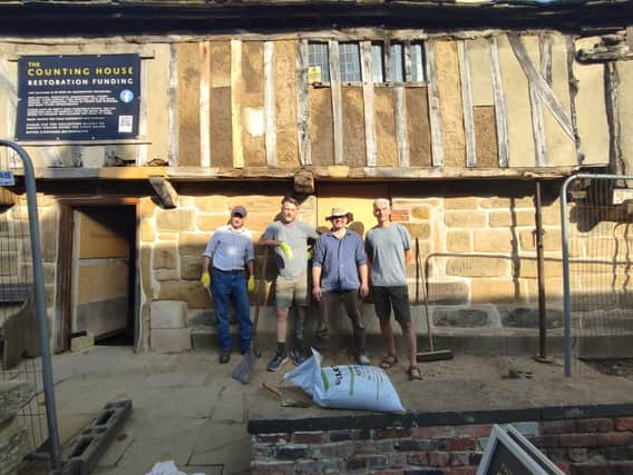 Work is continuing on the Counting House. Guy Lister, far right