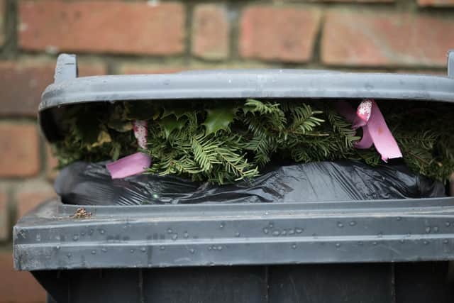 BRISTOL, ENGLAND - JANUARY 06:  Christmas decorations sit on top of rubbish in a bin waiting to be collected outside a residential property on January 6, 2017 in Bristol, England. Following the festive period many councils in UK are struggling to get on top of the huge amount of residential recycling and refuse that has been generated. In Bristol, the city's waste company, Bristol Waste has described the levels as being 'unprecedented' and the cause of some delays in collection.  (Photo by Matt Cardy/Getty Images)