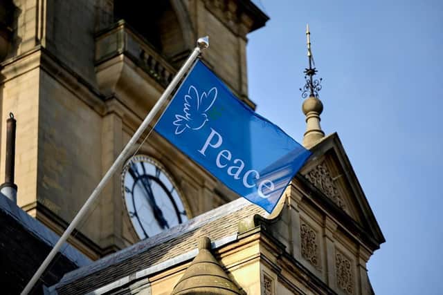 A peace flag has been raised above Wakefield Town Hall calling for an end to conflict in the Middle East