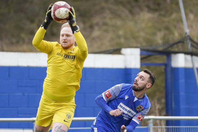 Brighouse Town goalkeeper Brett Souter claims the ball with Dec Bacon looking on. Picture Scott Merrylees