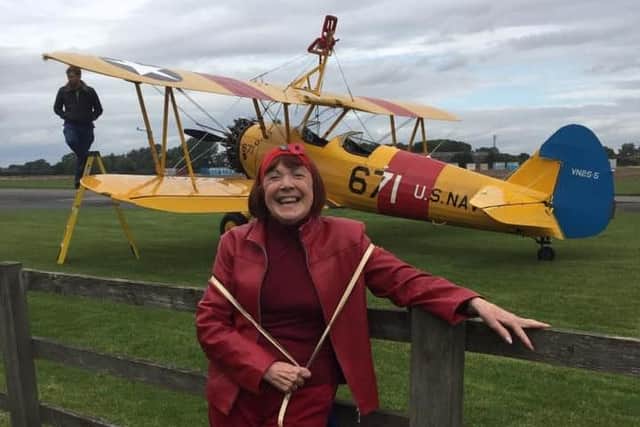 For her 80th birthday, June wing walked for the hospice dressed up as Red Baron.