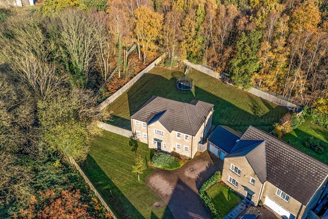 An aerial view of the property and its significant plot.