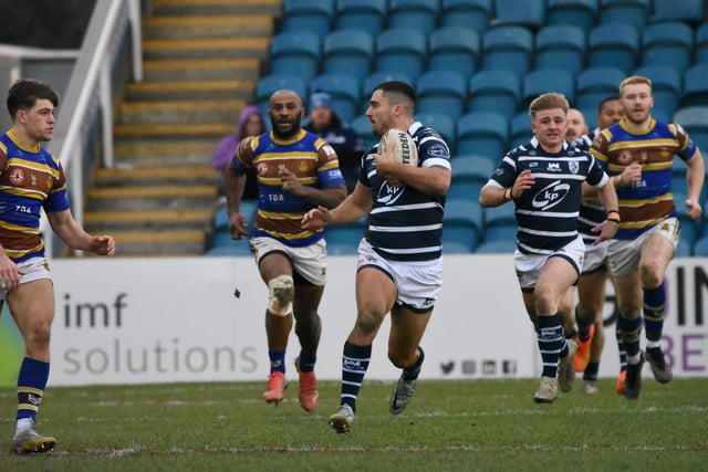 Caleb Aekins looks to get away for Featherstone Rovers.