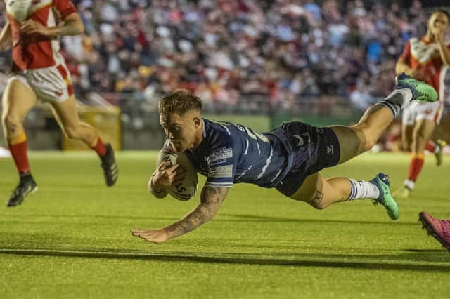 Morgan Smith dives over for one of his two tries for Featherstone Rovers against Sheffield Eagles. Picture: Dec Hayes