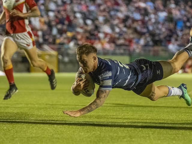 Morgan Smith dives over for one of his two tries for Featherstone Rovers against Sheffield Eagles. Picture: Dec Hayes
