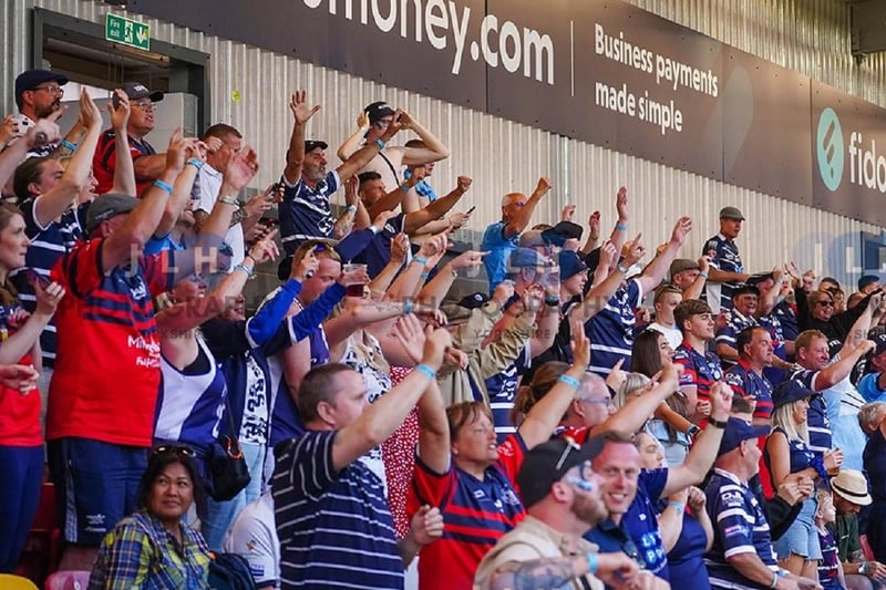 Supporters cheer Featherstone Rovers on.