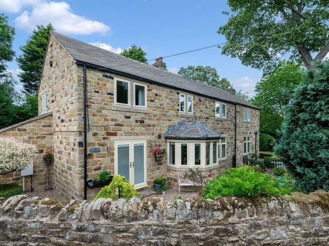 Looking across the stone built home that's for sale in the village of Woolley.