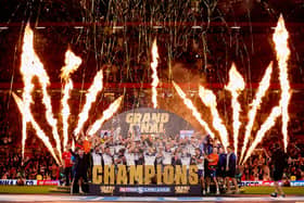 Wakefield Trinity lift the Super League trophy after beating Warrington Wolves in the Grand Final on Saturday. Photo: John Clifton.
