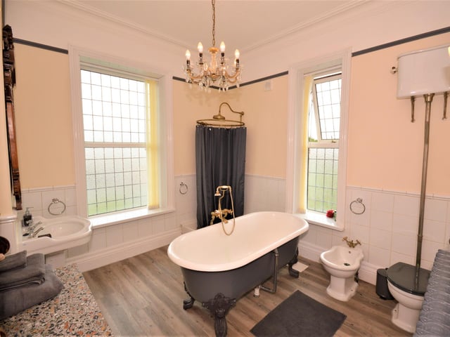 The four piece bathroom suite includes a stand alone, claw foot bath.