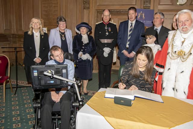 The Marathon is being done in honour of former Leeds Rhinos star Rob Burrow MBE( pictured with his wife Lindsey signing a book, and receiving the Honorary  Freedom of the City of Leeds at a special meeting of Leeds City Council at Leeds Civic Hall) to raise money and awareness of MND.  Picture Tony Johnson