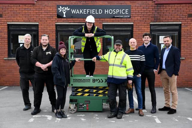 Wakefield Hospice volunteers and Horizon Platforms employees with the new lifting platform