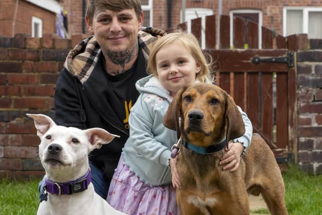 Beau Ferguson (pictured with his daughter Elsie and other dog Bella) rescued a dog called Paleo from Corfu. Picture Scott Merrylees