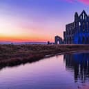 The sun sets as the Illumination of Whitby Abbey starts which runs over Halloween half term week.