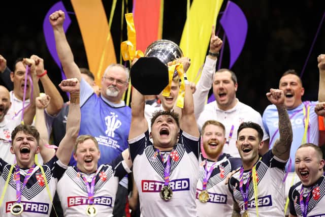 Ex Castleford student Tom Halliwell of England lifts the World Cup Trophy following the Wheelchair Rugby League World Cup Final match between France and England in November. Photo by Jan Kruger/Getty Images for RLWC