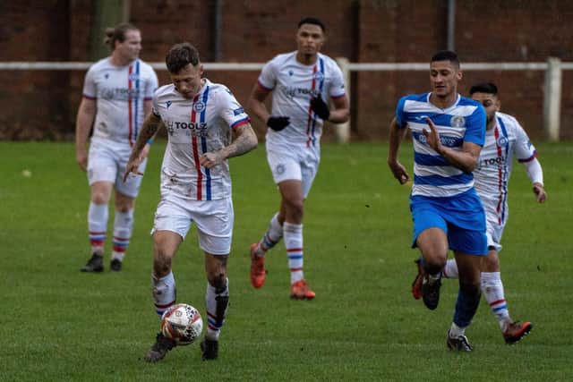Goal hero Billy Mole looks to go clear for Wakefield AFC against Glasshoughton Welfare. Picture: Scott Merrylees