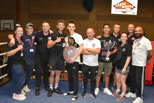 Ben England with the belt and White Rose Home Boxer of the Night shield, in memory of Tony Steel, he won. He is pictured with all the White Rose coaches and undefeated professional Central Area champ Dom Hunt.