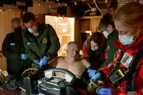 Robin Brown being treated at the Tan Hill Inn before being airlifted to hospital following a high-speed motorbike accident