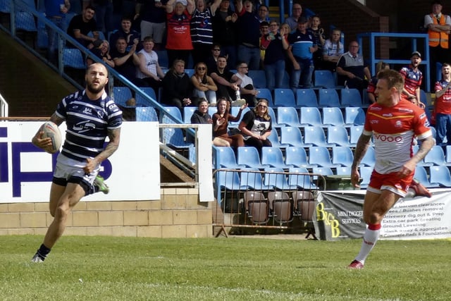 Luke Briscoe in the clear on the way to a runaway try for Featherstone Rovers.