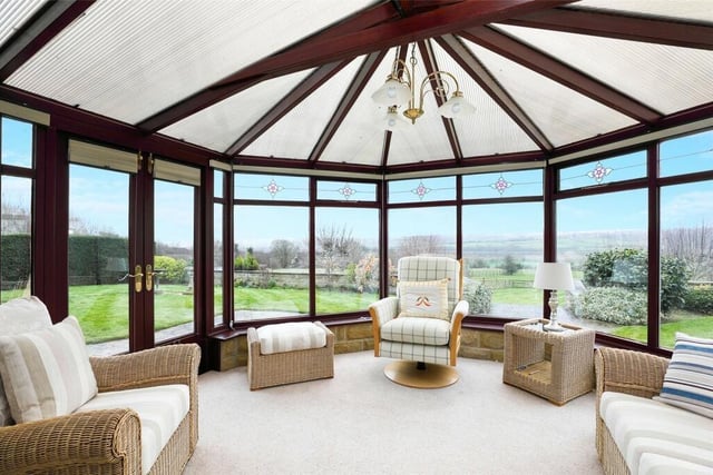 The conservatory is double glazed and makes the most of the incredible views.