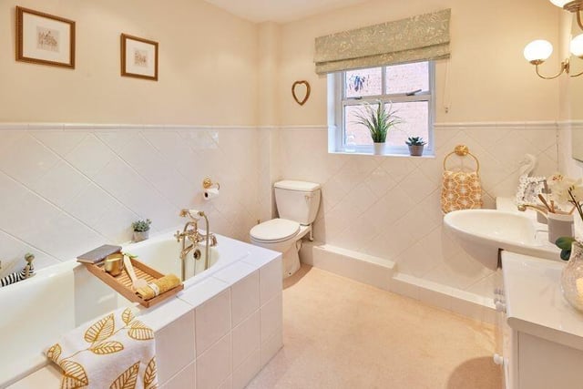 An elegant bathroom with built-in vanity unit.