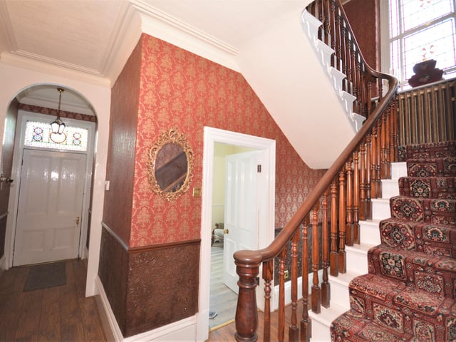The open plan kitchen with lounge, dining room and a sitting room with access to a balcony are all on the ground floor.