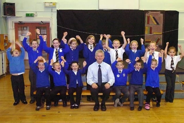 Eddy Price, head teacher at Three Lane Ends Primary School, and the school councillors, celebrates coming first place for attendance in the Wakefield primary school league in 2006.