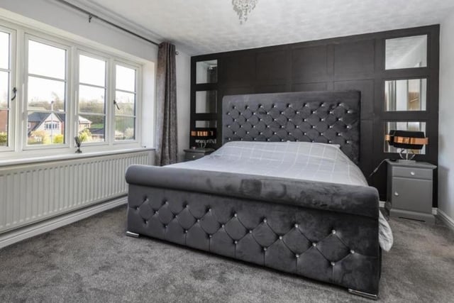 A spacious master bedroom which has a uPVC double glazed window to the front elevation, a central heating radiator and built-in wardrobes which provide shelving and hanging space.
